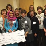 Photo of Washington Women's Foundation 2015 International Partner Grant committee with grantee Sahar and check