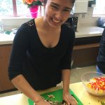 Photo of student with 2017 Health grantee FEEST cooking