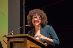 Kirsten Harris-Talley, Program Director at Progress Alliance of Washington, giving Morning Key Note speech at Intersect 2018, hosted by WA Women's Foundation